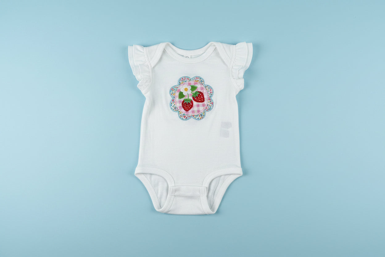 Strawberry patchwork appliqué onesie
